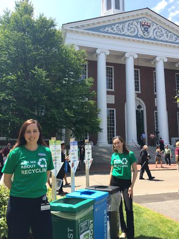 Leah Ricci (left) and Allison Webster (right) stand ready to help HBS Commencement attendees dispose of materials properly